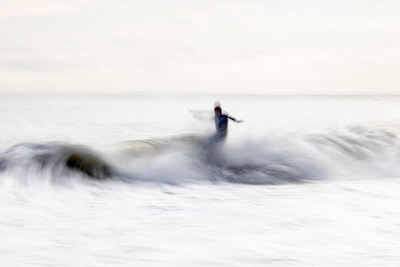 Surfer Riding Wave